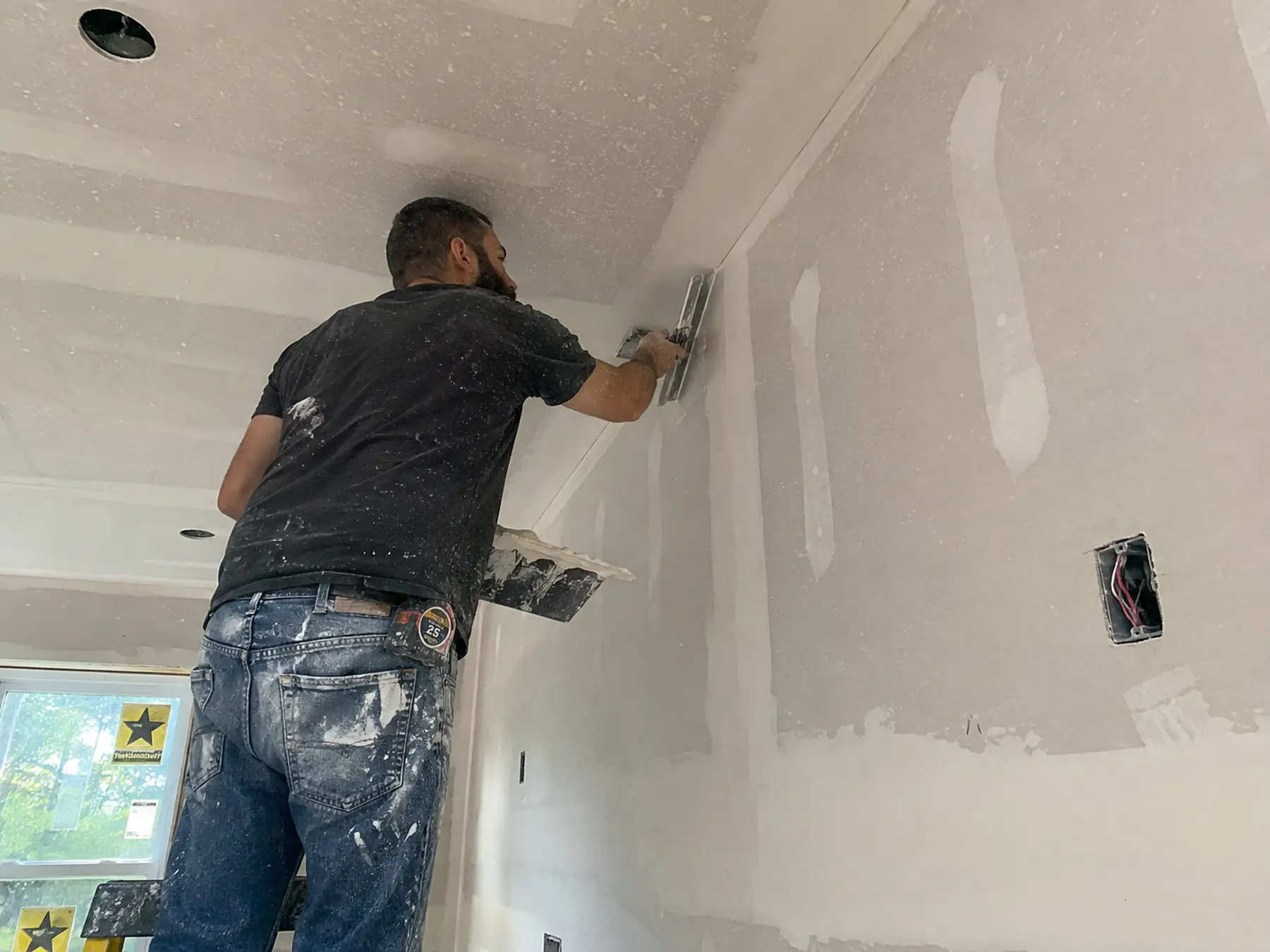 Drywall contractor at work on a Shreveport, Louisiana job
