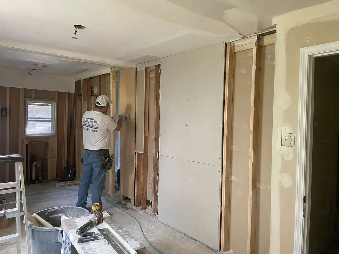Water-damaged drywall cut back to sound material
